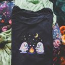  Faux (Printed, not real fabric / iridescence)   Irredescant Cute Spooky Halloween Ghosts Making Smores Around A Campfire - T-Shirt (Crewneck)  100 Cotton Heavyweight Tee (Unisex)  Comfort Colors