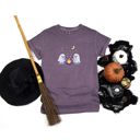  Faux (Printed, not real fabric / iridescence)   Irredescant Cute Spooky Halloween Ghosts Making Smores Around A Campfire - T-Shirt (Crewneck)  100 Cotton Heavyweight Tee (Unisex)  Comfort Colors