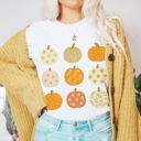  Faux (Printed, not real glitter or fabric)     Glitter Pumpkins In A Grid For Fall - T-Shirt (Crewneck)  100 Cotton Solid Colors Jersey Tee (Unisex)  Bella Canvas