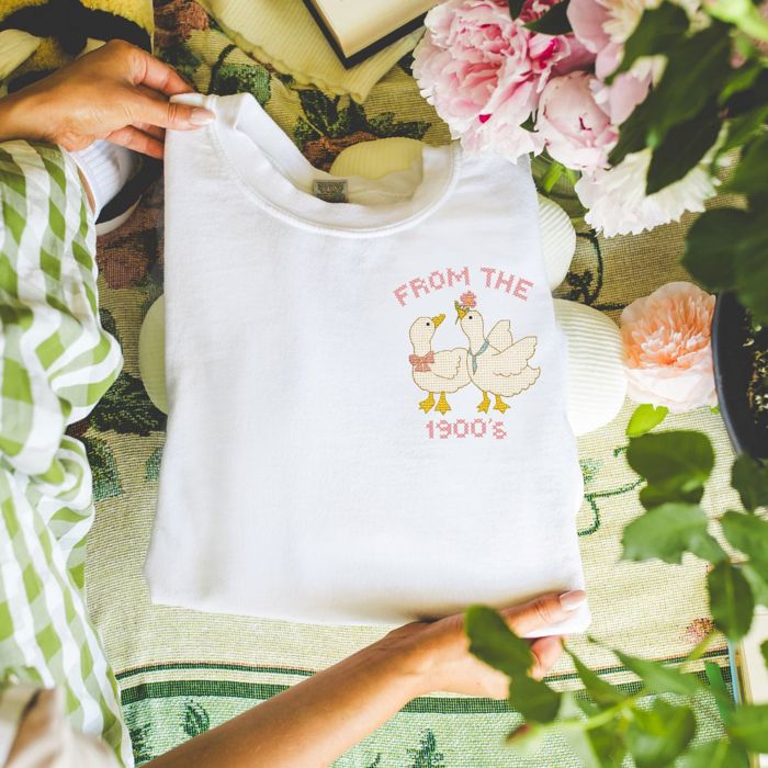 From The 1900s Faux (Printed, not real fabric or cross stitch)  Cross Stitch Cute 1980s Style Goose - Drop Shoulder Comfy Sweatshirt