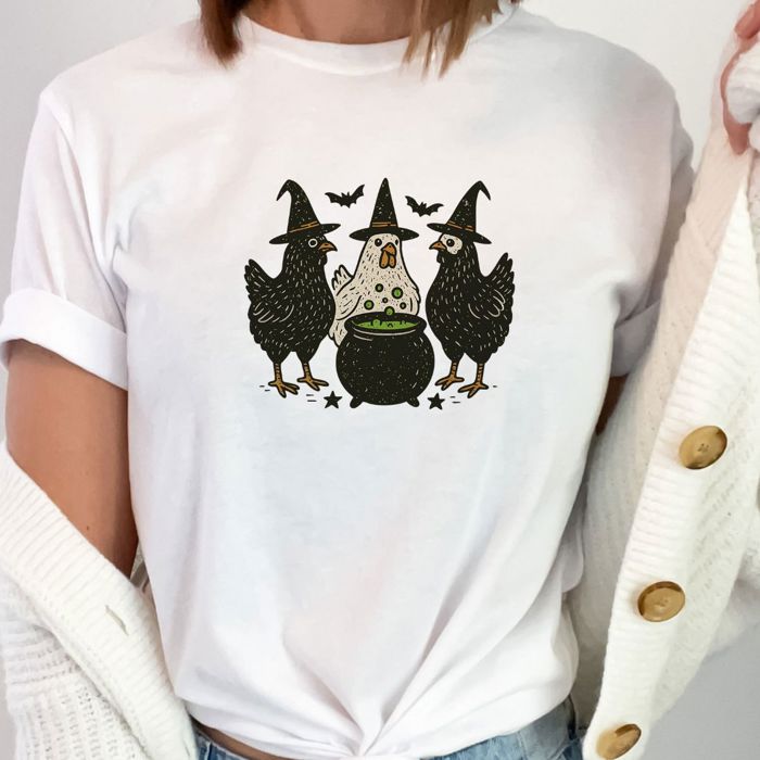 Three Chickens Around A Cauldron Cute Halloween Hens - Super Soft and Cozy Longer Length Bella Canvas T-Shirt