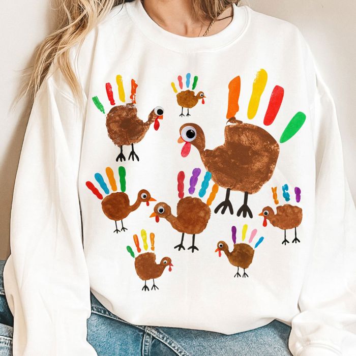 Faux (Printed, not real fabric)     Hand Painted Kids Craft Turkeys - Sweatshirt (Crewneck)  Poly-Cotton Colors (Unisex)  Gildan