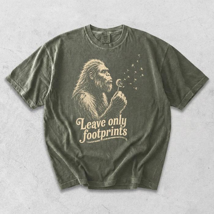 Leave Only Footprints - Big Foot Blowing Dandelion Seeds Making a Wish - T-Shirt Options (Main Image - Comfort Colors - Sage)