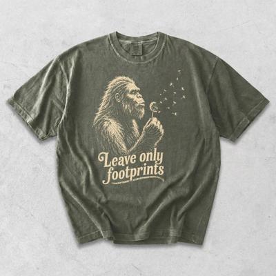Leave Only Footprints - Big Foot Blowing Dandelion Seeds Making a Wish - T-Shirt Options (Main Image - Comfort Colors - Sage)