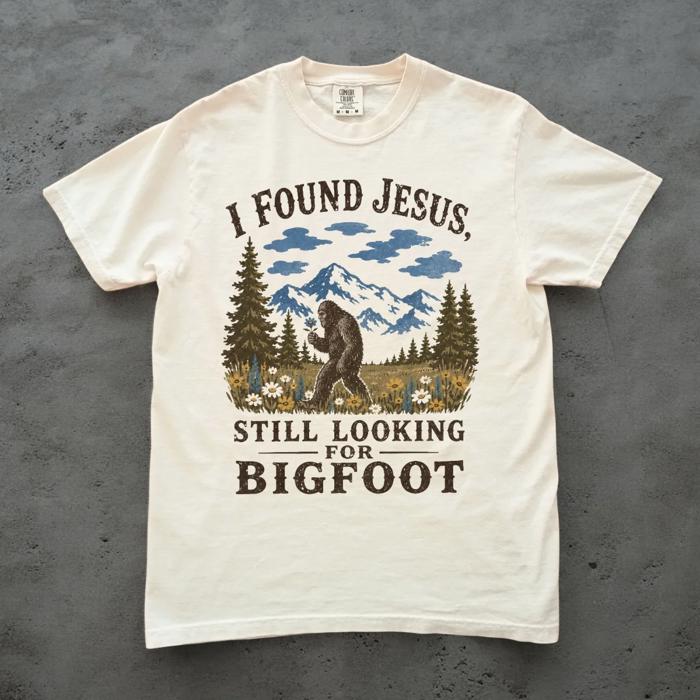 I Found Jesus, Still Looking For Bigfoot - Funny Christian Outdoorsy - T-Shirt Options (Main Image - Comfort Colors - Ivory)