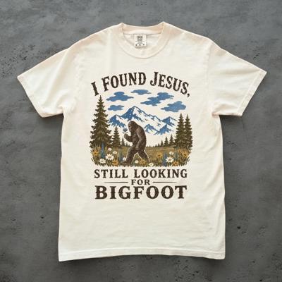 I Found Jesus, Still Looking For Bigfoot - Funny Christian Outdoorsy - T-Shirt Options (Main Image - Comfort Colors - Ivory)