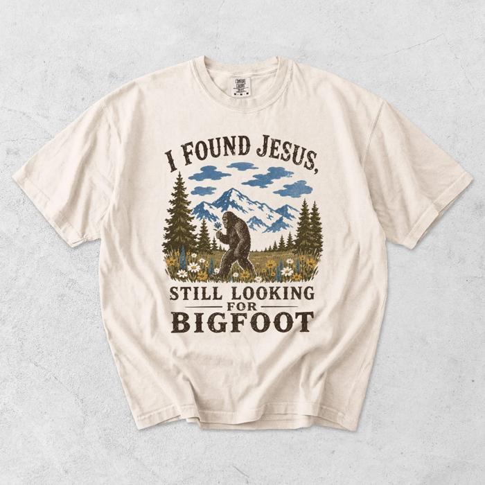 I Found Jesus, Still Looking For Bigfoot - Funny Christian Outdoorsy - T-Shirt Options (Main Image - Comfort Colors - Ivory)