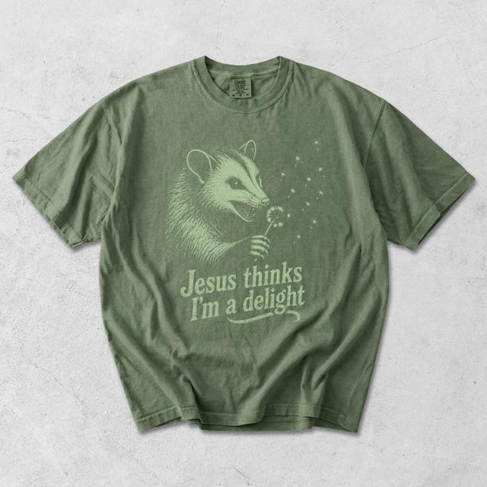 Jesus Thinks Im A Delight Possum Dandelion - Comfy T-Shirt Options (Main Image - Comfort Colors - Pepper)