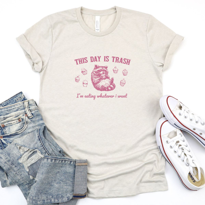 Raccoon Revelry: Embrace the Chaos of Cupcakes! Soft Cozy Longer Length Unisex Graphic Tee T-shirt