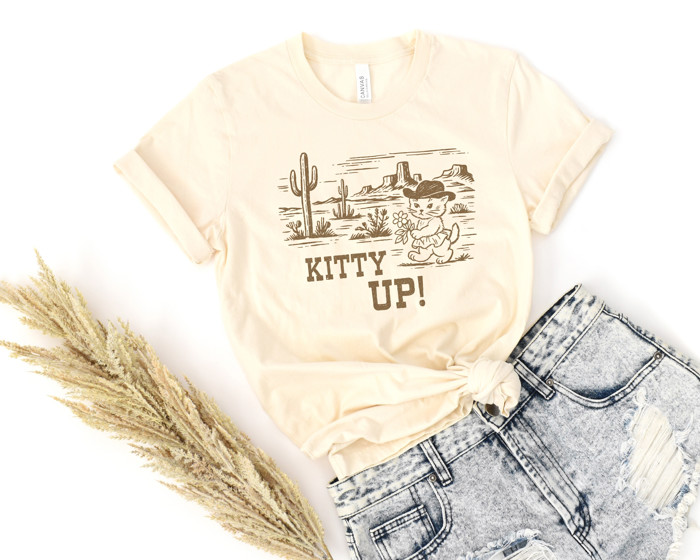 KITTY UP! | Saddle Up for a Purr-fect Adventure! Soft Cozy Longer Length Unisex Graphic Tee T-shirt