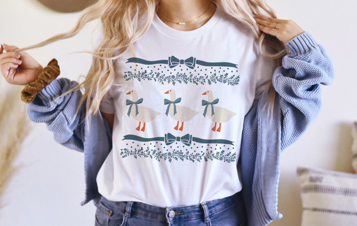 Original 1980's Grandma Blue Ribbon Goose Geese with Bows and Floral Accents | A Charming Parade of Whimsical Geese Soft Cozy Longer Length Unisex Graphic Tee T-shirt