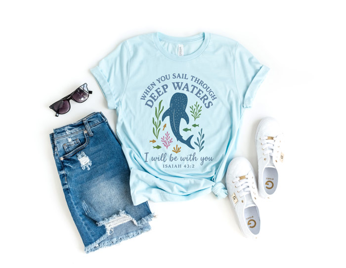 WHEN YOU SAIL THROUGH DEEP WATERS | Guiding Light in Troubled Seas Soft Cozy Longer Length Unisex Graphic Tee T-shirt