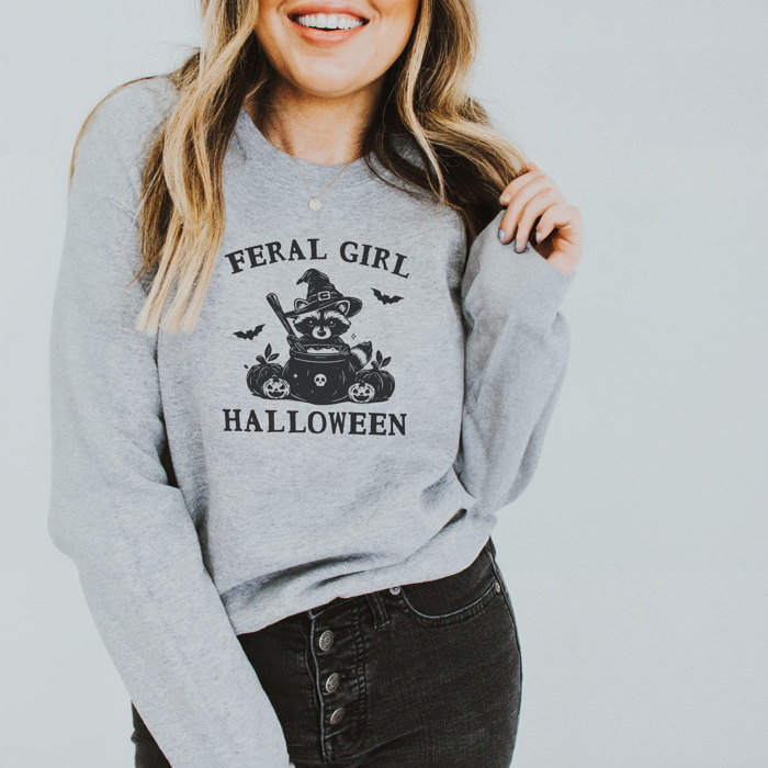 FERAL GIRL HALLOWEEN | Enchanted Mischief: A Spooky Tale of a Trickster's Brew Soft Cozy Longer Length Unisex Graphic Tee T-shirt