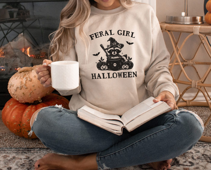FERAL GIRL HALLOWEEN | Enchanted Mischief: A Spooky Tale of a Trickster's Brew Soft Cozy Longer Length Unisex Graphic Tee T-shirt