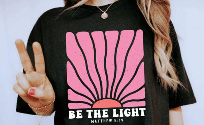 Be the Light Christian Graphic Tee Matthew 5:14 Bible Verse Inspirational Black T-Shirt