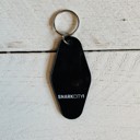  It's Better To Arrive Late, Than To Arrive Ugly Keychain in Black and White
