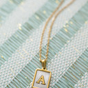 A Gold Mother of Pearl Initial Letter Necklace