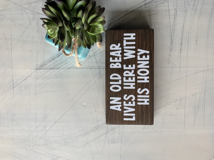 An old bear lives here with his honey - mini wood sign