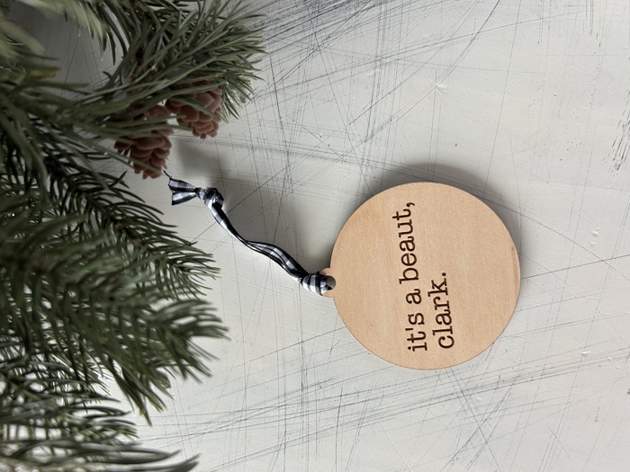 It's a beaut, clark. - Engraved Maple Ornament with Buffalo Plaid Ribbon
