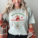 Medium Bay Light Sage North Pole Candy Company Christmas Retro Sign Nostalgic Holiday Storefront Display Comfort Colors Tee