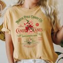 Small Mustard North Pole Candy Company Christmas Retro Sign Nostalgic Holiday Storefront Display Comfort Colors Tee