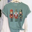 Small Light Green Retro Nutcrackers Classic Colorful Christmas Print Illustration For Holiday Season And Nostalgia Comfort Colors Tee
