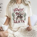  Howdy Santa Cowboy Reindeer Rodeo Desert Cactus Christmas Western Frontier Holiday Vintage Vibe Comfort Colors Tee