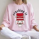 Large Light Pink Crushing It Nutcracker Retro Festival Thematic Holiday Seasonal Graphic Sweatshirt