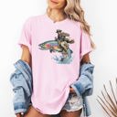 Large Blossom Light Pink Cowboy Riding Rainbow Trout Rodeo Club Western Adventure Edition Comfort Colors Tee