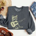  Raccoon Playing A Guitar In A Whimsical Forest Scene With Playful Vibe Sweatshirt