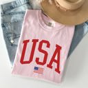 Large Blossom Light Pink USA Flag Patriotic American Pride Print Emblem With Bold Stars And Stripes Across The Banner Comfort Colors Tee