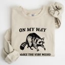 XL Sand Weird Vibes Raccoon Meme Graphic Whimsical Pop Culture Humor Inspired Edition Sweatshirt
