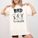 Small Ivory Cream Bad To The Bone Skeleton Witch Halloween Spooky Vintage Gothic Motifs And Timeless Charm Comfort Colors Tee