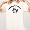 Small Ivory Cream Feelin Feral Raccoon Aesthetic Trendy Humorous Playful Illustrative Comfort Colors Tee