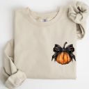 Medium Sand Halloween Pumpkin Ribbon Pocket Print Coquette Fall Autumn Cozy Festive Edition Sweatshirt