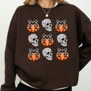 Small Dark Chocolate Brown Skulls And Checkered Pumpkins Coquette Ribbons And Bows Halloween Inspired Sweatshirt