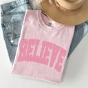 Large Blossom Light Pink Believe Varsity Collegiate Christmas Santa Winter Xmas Classic Comfort Colors Tee