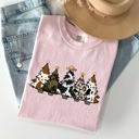 Medium Blossom Light Pink Cowboy Christmas Trees With Winter Snow Santa Silhouette Western Holiday Scene Comfort Colors Tee