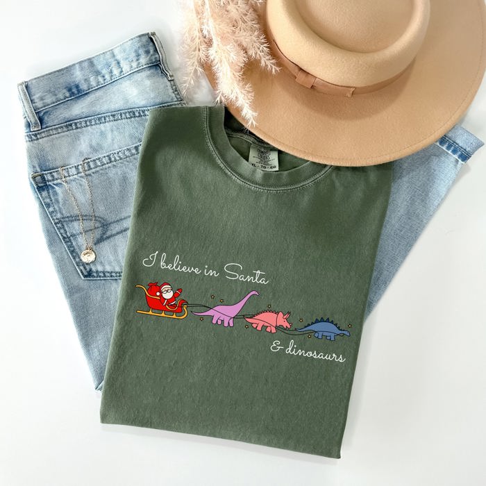 I Believe In Santa And Dinosaurs Sleigh Reindeer Christmas Winter Xmas Comfort Colors Tee