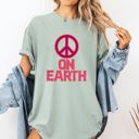 Medium Bay Light Sage Peace On Earth Christmas Positivity Snow Santa Xmas Seasonal Joy Comfort Colors Tee