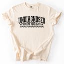 Small Ivory Cream Undiagnosed, But Something Ain't Right Funny Tism Mental Health Sassy Comfort Colors Tee