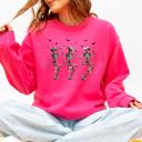 Large Crunchberry Bright Pink Dancing Cowboy Skeletons Halloween Bats Western Night Parade Cozy Graphic Sweatshirt