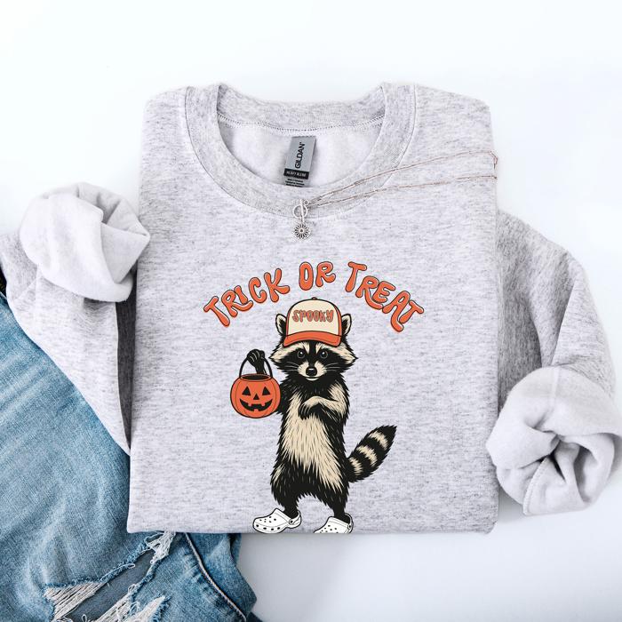 Raccoon Trick Or Treat Halloween Spooky Cozy Nighttime Autumn Theme Seasonal Fun Sweatshirt