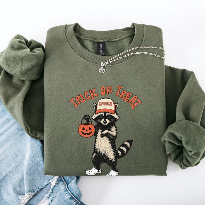 Raccoon Trick Or Treat Halloween Spooky Cozy Nighttime Autumn Theme Seasonal Fun Sweatshirt