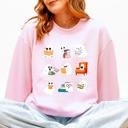 Large Light Pink Reading Ghosts Halloween Library Books Cozy Night In Vintage Deluxe Graphic Sweatshirt