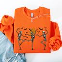 XXXL Orange Skeleton Dancers Halloween Parade Vintage Moonlit Street Scene Cozy Retro Sweatshirt
