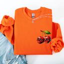 Medium Orange Spooky Skull Cherries Halloween Skeleton Stars Night Sky Ghosts Haunted Festival Scene Sweatshirt