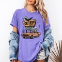 Small Violet Purple The Skeleton Motel Reading Skeletons Spooky Halloween Graphic Comfort Colors Tee