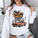 Large White The Skeleton Motel Spooky Halloween Sweatshirt