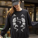 Medium Black Dancing Skeletons Ghost Witch Skull Spooky Halloween Costume Party Edition Sweatshirt